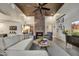 Stylish living room featuring a brick fireplace, high ceilings, and neutral color palette at 31 E Bishop Dr, Tempe, AZ 85282