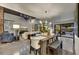 Open-concept living and dining area with a fireplace and access to outdoor pool area at 31 E Bishop Dr, Tempe, AZ 85282