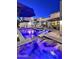 Inviting modern pool area with in-pool lounge chairs and shade umbrellas at twilight at 31 E Bishop Dr, Tempe, AZ 85282