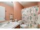 Bathroom with a white sink and a shower featuring a decorative cactus-themed curtain at 3212 W Lucia Dr, Phoenix, AZ 85083