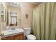 Bathroom features a shower/tub combo with vanity and tiled countertop at 3212 W Lucia Dr, Phoenix, AZ 85083