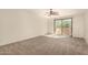 Spacious bedroom with a ceiling fan and sliding glass doors to the outside at 333 N Pennington Dr # 63, Chandler, AZ 85224