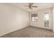 This bedroom has a ceiling fan, and direct access to the backyard from the sliding door at 333 N Pennington Dr # 63, Chandler, AZ 85224