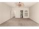 Large bedroom with neutral carpet, multiple doors, and decorative glass block at 333 N Pennington Dr # 63, Chandler, AZ 85224