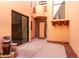 Charming courtyard with tile flooring, mature landscaping, and a decorative water feature at 333 N Pennington Dr # 63, Chandler, AZ 85224