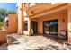 Exterior of a terracotta stucco home with multiple patios and desert landscaping at 333 N Pennington Dr # 63, Chandler, AZ 85224