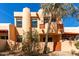 Two-story home exterior shows stucco walls, covered entrance, patios, and a desert landscaped yard at 333 N Pennington Dr # 63, Chandler, AZ 85224