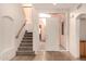 Bright foyer with staircase and large window panes surrounding the front door at 333 N Pennington Dr # 63, Chandler, AZ 85224