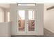 Second floor hallway with neutral carpet and access to a private balcony at 333 N Pennington Dr # 63, Chandler, AZ 85224