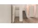 Hallway featuring staircase and access to other rooms with wood-look flooring at 333 N Pennington Dr # 63, Chandler, AZ 85224