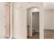 Bright hallway with an arched entryway into the powder room bathroom at 333 N Pennington Dr # 63, Chandler, AZ 85224