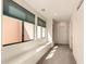 Bright hallway features large windows with shades and neutral carpet flooring at 333 N Pennington Dr # 63, Chandler, AZ 85224