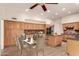 Spacious kitchen with wood cabinets, granite countertops, stainless steel appliances and an island with seating at 333 N Pennington Dr # 63, Chandler, AZ 85224