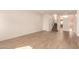 Large living area with wood-look flooring, staircase, and ample natural light from the foyer at 333 N Pennington Dr # 63, Chandler, AZ 85224