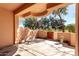 A private patio offers an outdoor living space with direct access to the green common area at 333 N Pennington Dr # 63, Chandler, AZ 85224