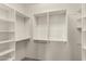 This walk-in closet has open, modular shelving and ample storage space at 333 N Pennington Dr # 63, Chandler, AZ 85224