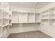 Walk-in closet with open shelving for plenty of storage and organization at 333 N Pennington Dr # 63, Chandler, AZ 85224