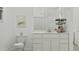Bathroom boasts a modern vanity, toilet, and art, all complemented by soft, natural light and a soothing color palette at 3783 E Gold Mountain Ave, San Tan Valley, AZ 85143