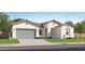Charming single-story home featuring a gray garage door, desert landscaping, and a neutral stucco exterior at 3783 E Gold Mountain Ave, San Tan Valley, AZ 85143