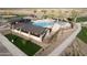 Aerial view of a community pool with palm trees, covered seating areas, and a splash pad for  at 3783 E Gold Mountain Ave, San Tan Valley, AZ 85143