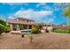 Beautiful backyard showcasing a pool, outdoor kitchen, patio, and putting green at 4297 E Pyrenees Ct, Gilbert, AZ 85298