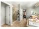 Bathroom featuring a tile shower, soaking tub, and vanity with decorative lighting and tile flooring throughout at 4297 E Pyrenees Ct, Gilbert, AZ 85298