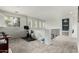 Upstairs loft area filled with natural light, neutral carpet, a workout area, and staircase access to other floors at 4297 E Pyrenees Ct, Gilbert, AZ 85298