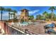 Beautiful pool area featuring a waterslide, tower, and comfortable seating for relaxation, perfect for resort-style living at 4297 E Pyrenees Ct, Gilbert, AZ 85298
