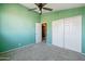 Bedroom featuring carpet, ceiling fan, closet and doorway at 4617 E Montgomery Rd, Cave Creek, AZ 85331