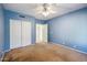 Bedroom features carpet, ceiling fan, and a closet at 4617 E Montgomery Rd, Cave Creek, AZ 85331