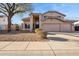 Inviting two-story home features a neutral color palette, well-maintained landscaping, and a spacious three-car garage at 4617 E Montgomery Rd, Cave Creek, AZ 85331