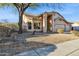 Charming home featuring desert landscaping, a mature tree, and a well-maintained front yard at 4617 E Montgomery Rd, Cave Creek, AZ 85331