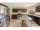 Well-equipped kitchen featuring stainless steel appliances, granite countertops, and dark wood cabinets at 4617 E Montgomery Rd, Cave Creek, AZ 85331