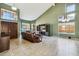 Bright living room with high ceilings, multiple windows, and a leather sofa, offering a welcoming space at 4617 E Montgomery Rd, Cave Creek, AZ 85331