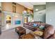 Comfortable living room with a leather sofa, wooden coffee tables, and an airy, open layout at 4617 E Montgomery Rd, Cave Creek, AZ 85331