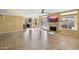 Spacious living room with fireplace, outdoor patio access, and tile flooring at 4617 E Montgomery Rd, Cave Creek, AZ 85331