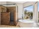 Luxurious bathroom with walk-in shower, freestanding tub, and bright window views at 4617 E Montgomery Rd, Cave Creek, AZ 85331