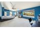 Large primary bedroom with ceiling fan, television, sitting area and large windows at 4617 E Montgomery Rd, Cave Creek, AZ 85331