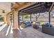 Inviting covered patio features comfortable seating, a fire pit, and a view of the pool at 4617 E Montgomery Rd, Cave Creek, AZ 85331