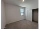 Bedroom features neutral carpet, a sliding-door closet, and a sunlit window at 47734 W Moeller Rd, Maricopa, AZ 85139