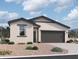 Charming single-story home featuring a stucco facade, gray roof, and two-car garage at 47734 W Moeller Rd, Maricopa, AZ 85139