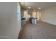 Charming kitchen with gray cabinets, black counters, and an island with wood-style flooring at 47734 W Moeller Rd, Maricopa, AZ 85139