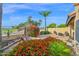 Beautiful backyard with vibrant flowers, a swing, and views of the golf course at 5505 E Mclellan Rd # 41, Mesa, AZ 85205