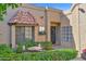 Inviting front porch with wrought iron seating area, flower box, and charming front door at 5505 E Mclellan Rd # 41, Mesa, AZ 85205