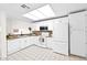 Bright, clean kitchen featuring white cabinets, stainless steel appliances and tile flooring at 5505 E Mclellan Rd # 41, Mesa, AZ 85205