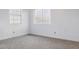Bedroom with two windows and neutral carpet at 5742 W Shannon St, Chandler, AZ 85226
