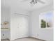 Cozy bedroom with a window, closet, ceiling fan, and neutral carpet at 5742 W Shannon St, Chandler, AZ 85226