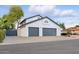 Charming home featuring a white stucco exterior and a spacious two-car gray garage at 5742 W Shannon St, Chandler, AZ 85226