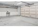 Spacious garage featuring ample storage, built-in shelving and a clean, well-lit interior at 5742 W Shannon St, Chandler, AZ 85226