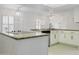 Modern kitchen featuring granite countertops, white cabinets, and updated appliances at 5742 W Shannon St, Chandler, AZ 85226